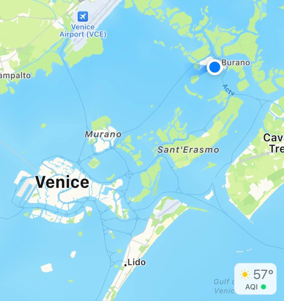 A map of Venice with a blue you are here dot over Burano